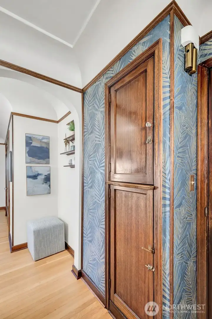 Entry way- to your left coat closet, to your right these built in cabinets.