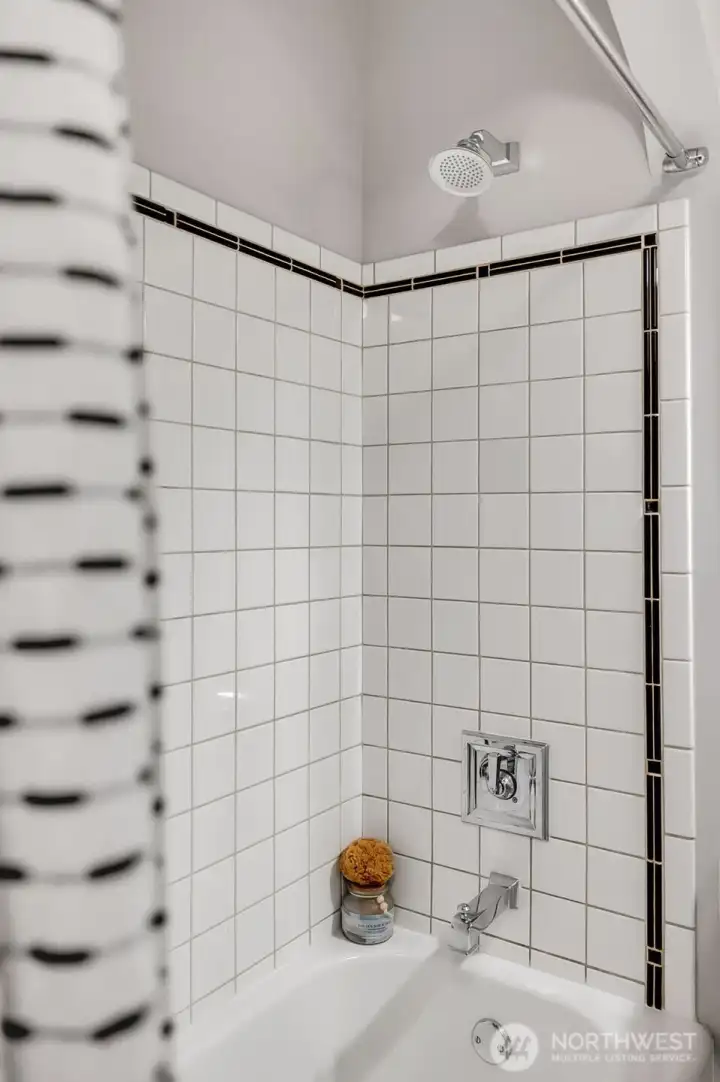 Shower with tile surround.
