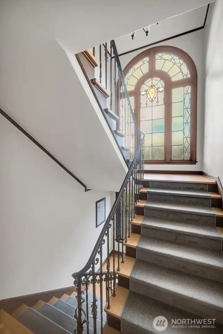 Original stained glass in common stairwell.