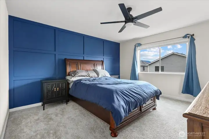 Primary bedroom featuring new accent wall.