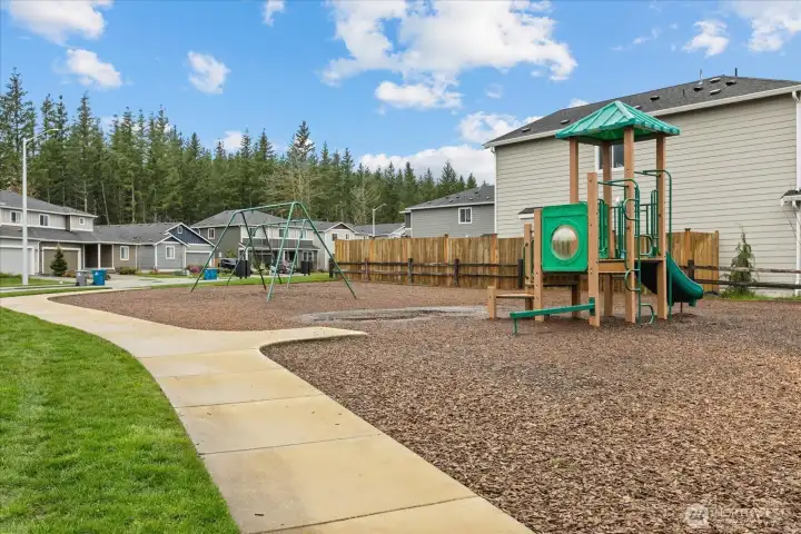 Playground located kitty-corner to the home.