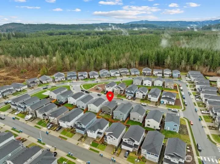Aerial view of the home and neighborhood looking southward.