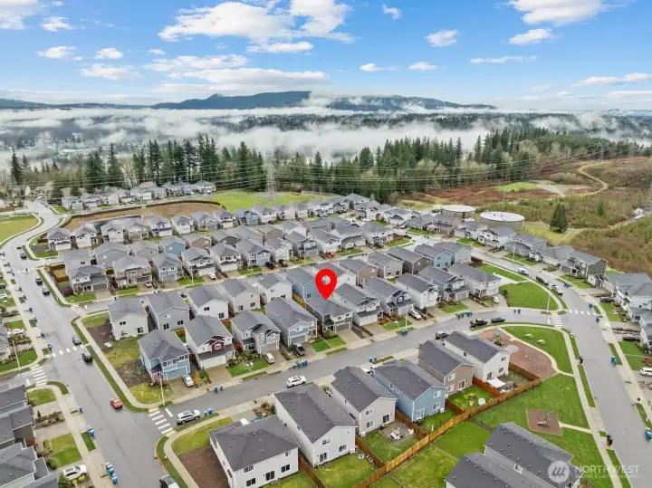 Aerial view of the home and neighborhood looking northward.