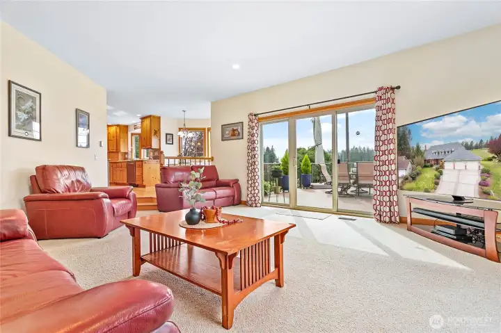 Nearly opposite the main level from the living room you'll find the large family room. Fresh paint, tons of windows & access to huge custom deck