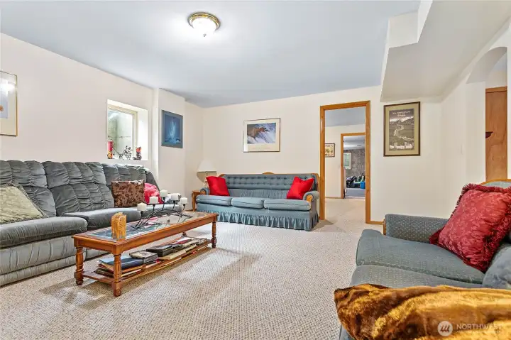 Rec room to right through arch, through door ahead is another room!