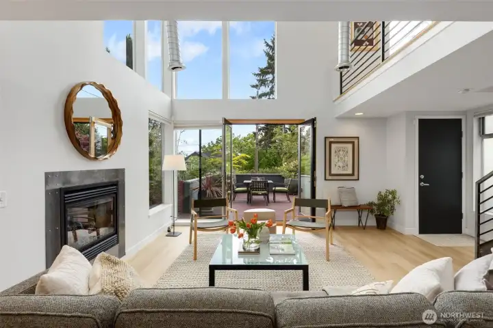 French doors extend the living room to the front deck, blurring the line between indoor comfort and outdoor enjoyment.
