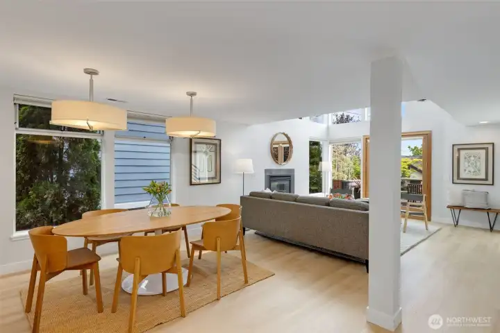 The dining room, framed by large picture windows provides a great setting for intimate dinners or lively gatherings with friends and family.