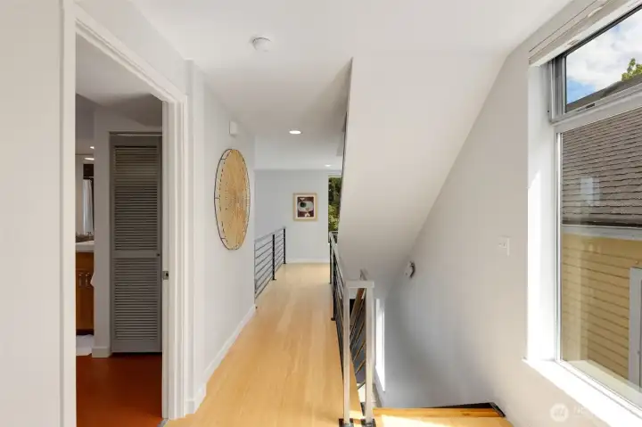 Bamboo floors and natural light give the hallway a warm welcoming feel