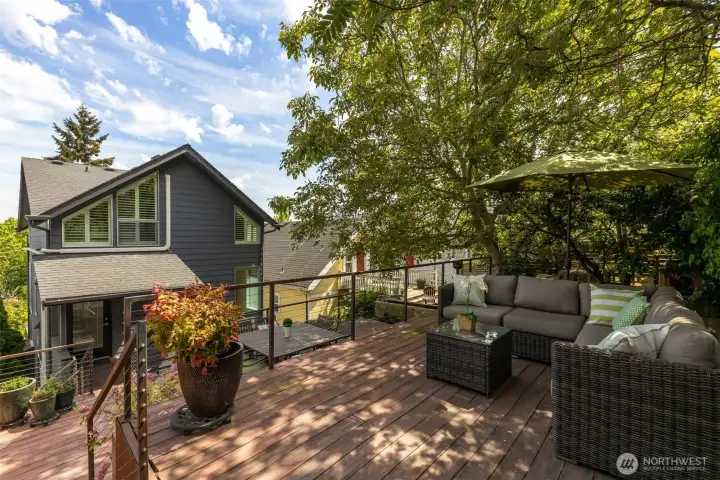 Upper deck - wonderful oasis that further extends the home's living space outdoors.
