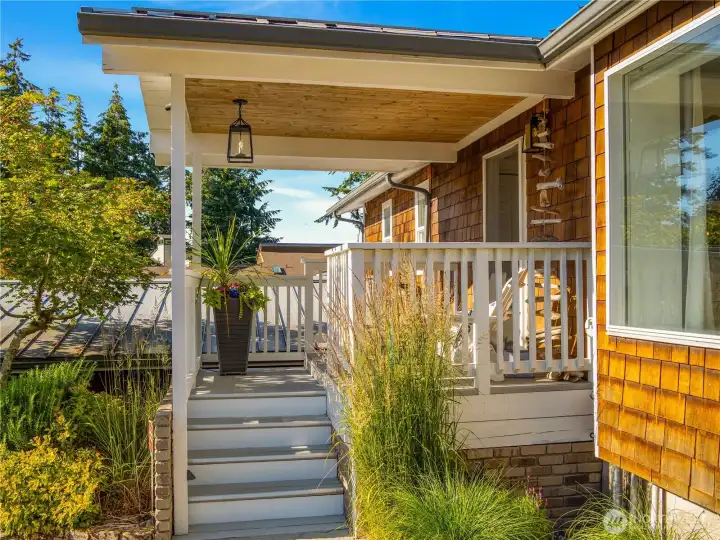 The quaint front porch welcomes you in.