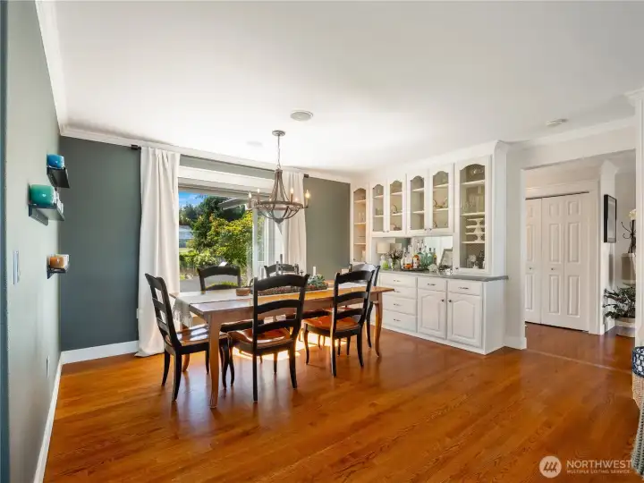 Whether you like to dine inside or outside, this home will not disappoint. the custom built-in allows oodles of storage while adding classic charm. The oak floors highlights all the nice features of this home.