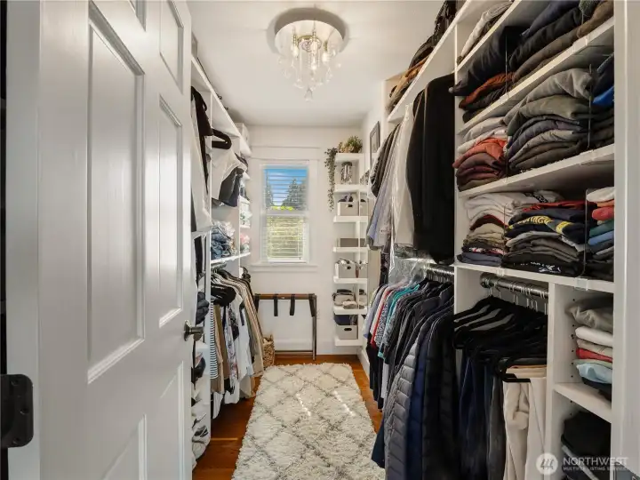 Large custom organized walk-in closet with room for all your cloths.