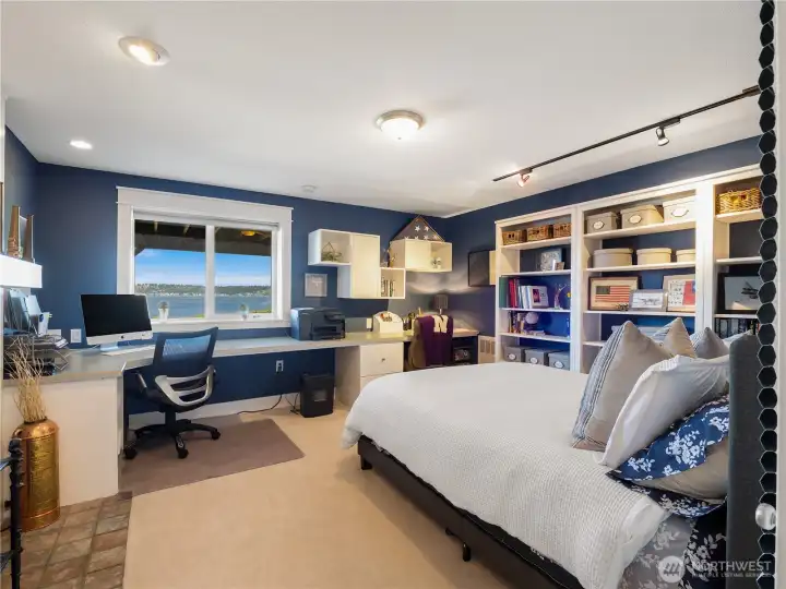 The office is so large that it can double as a guest room. The built in desk makes work less cumbersome since you can dream your day away while looking out the window. If you get cold, make a fire in the fireplace.