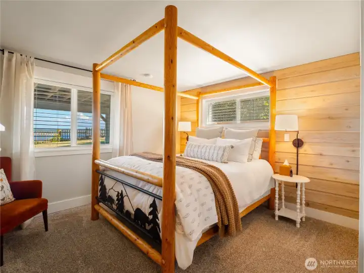 This cozy guest room has ship lap for added coziness. Some of the furniture in the home could be purchased if that is of interest.