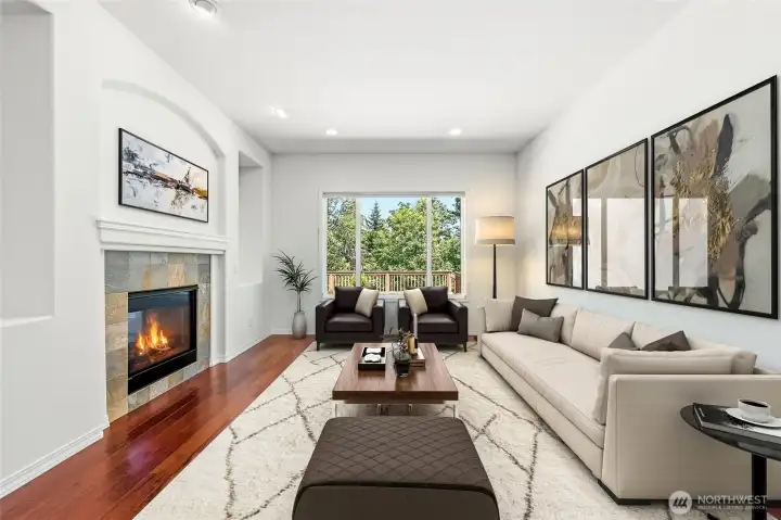 The formal living room has a double sided fireplace shared with the great room. Virtually staged.