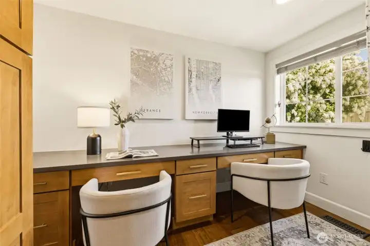 Bonus! A convenient den upstairs is ideal as an office, nursery, or storage with built in desk and cabinets