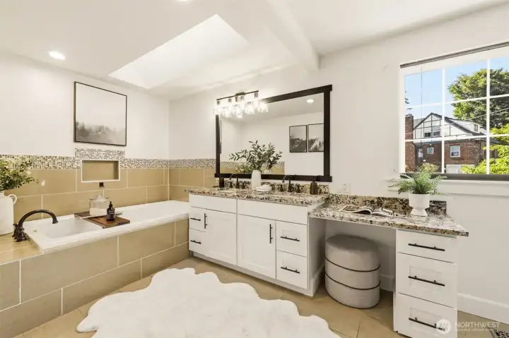 The primary bathroom makes every day feel like a spa day with a large soaking tub, spacious shower, and separate water closet