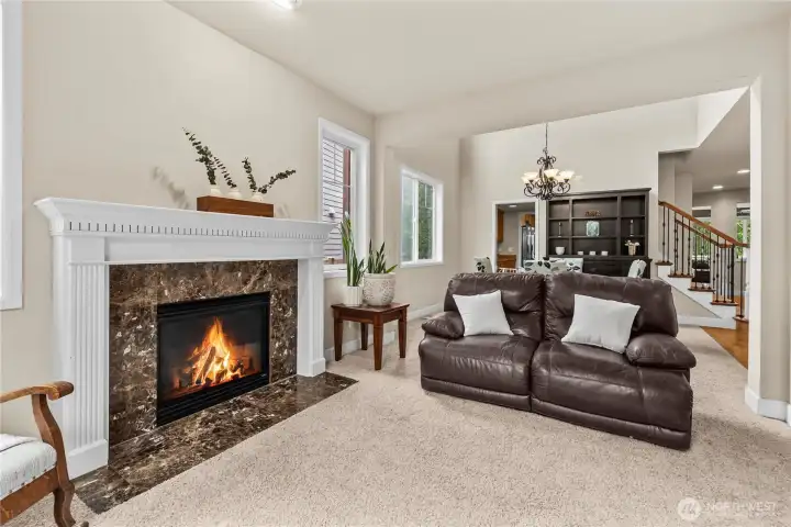 Living Room featuring one of three fireplaces