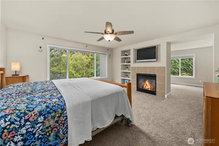 Primary Suite with double sided fireplace and two oversized walk in closets