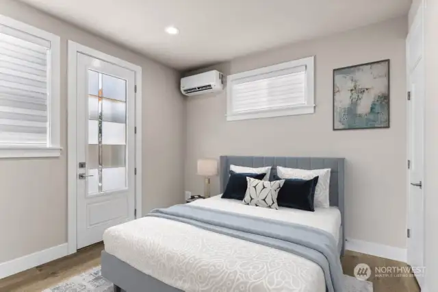 Virtual staging.  Lower level bedroom / office with its own outside entrance, separate mini split for heating and cooling, and attached 3/4 bathroom.