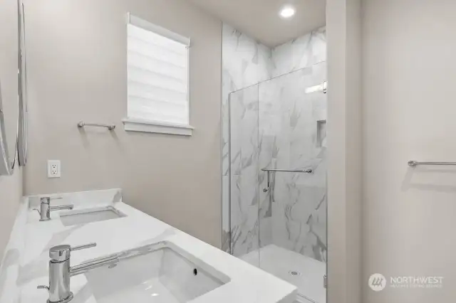 Primary bathroom with the full height tile shower.