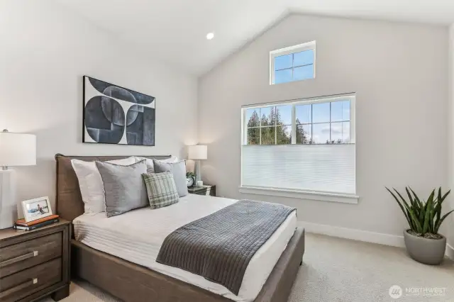 Spacious Bdrm 2, vaulted ceilings, can lights and large windows.