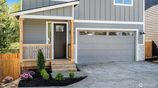 Covered front porch. Drive way has turn around space.