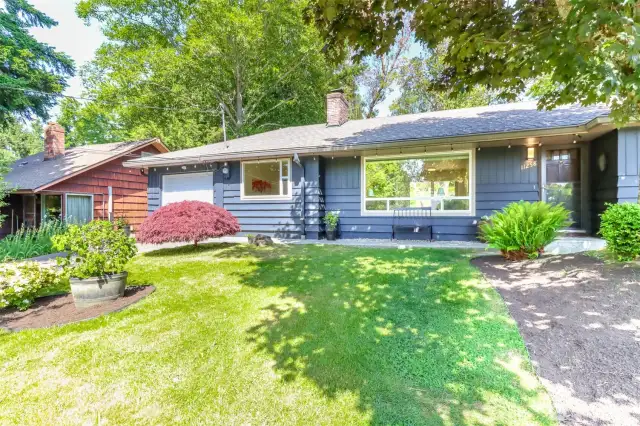 Yard is beautifully landscaped and maintained.