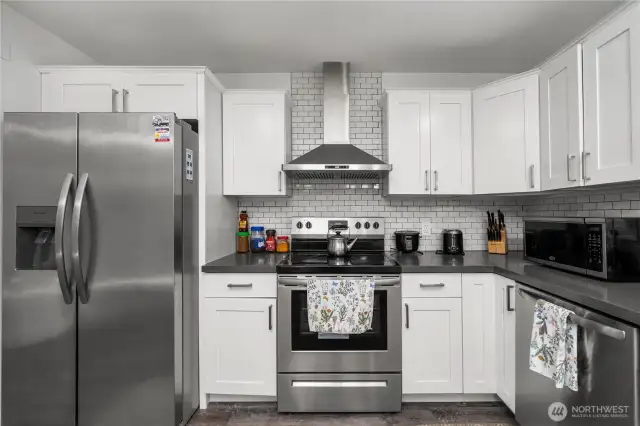 White and bright kitchen with newer appliances.
