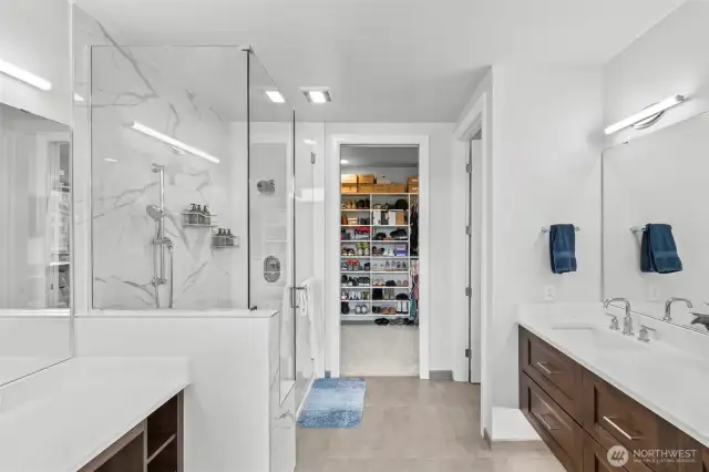Spa-quality bath with heated floors, Quartz counters & dual sinks.  There is under-cabinet lighting that works as a great night light.