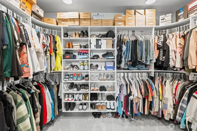 The huge primary closet with organizers can handle an extensive wardrobe.