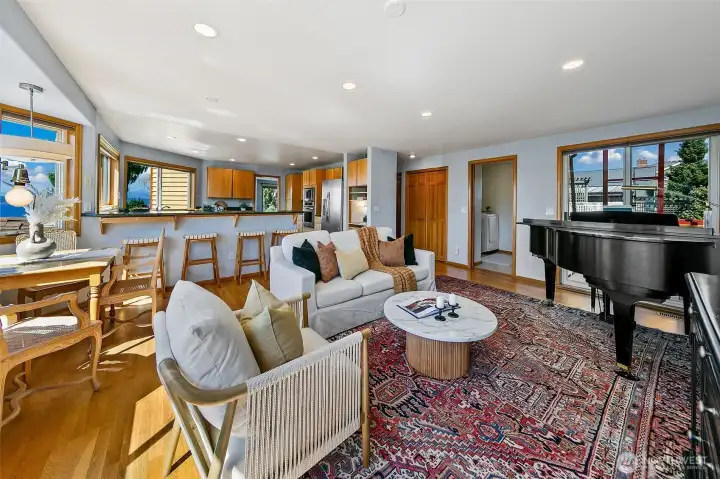 TV/Family room has a access to a covered porch; perfect for all season BBQ or cold storage.