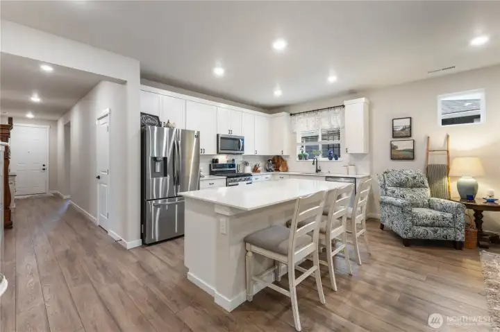 Open and bright with a walk in pantry the oversized island offers plenty of eating and cooking space.
