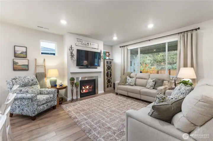 The gas fireplace is the focal point of this comfortable living room keeping you warm in the winter and the heat pump offers cooling in the summer months.