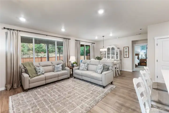 Large windows let in plenty of light off the covered patio and the beautiful, easy to care for LVP offers a lovely backdrop for all your furnishings.