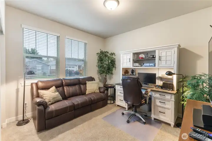 Bedroom at front of home can also be used as an additional office.