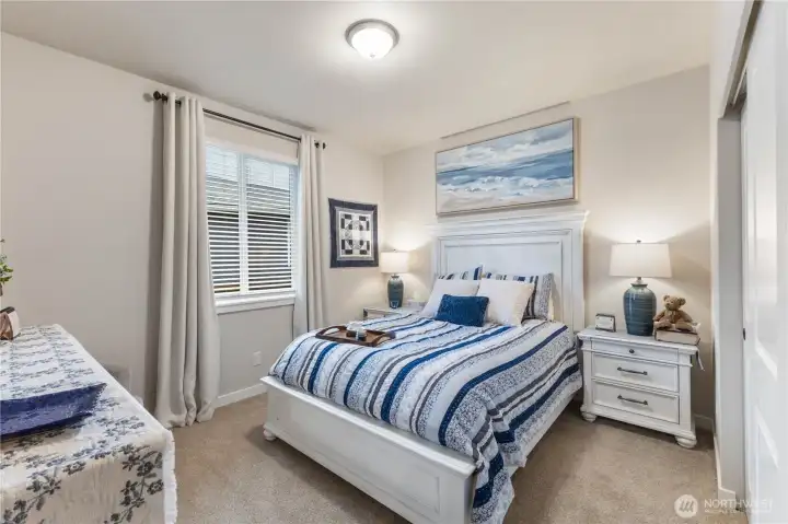 Two bedrooms are situated at the front of the home with guest bath in between for convenience.