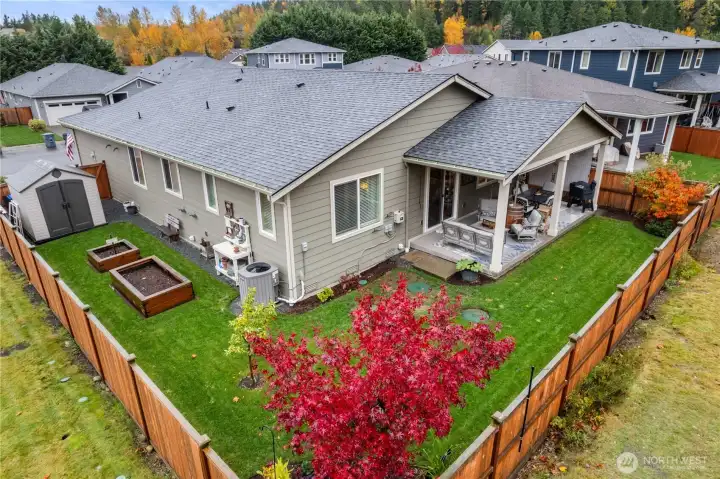 Mature landscaping in both front and back yard adds dimension and beauty to the yard.