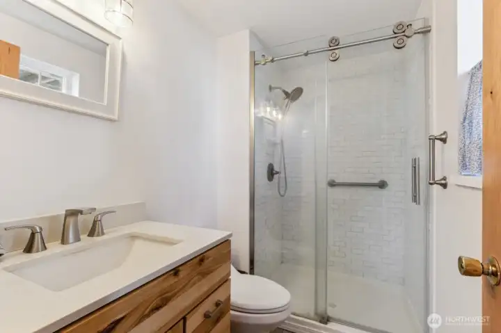 Master bath with tile and walk-in shower.