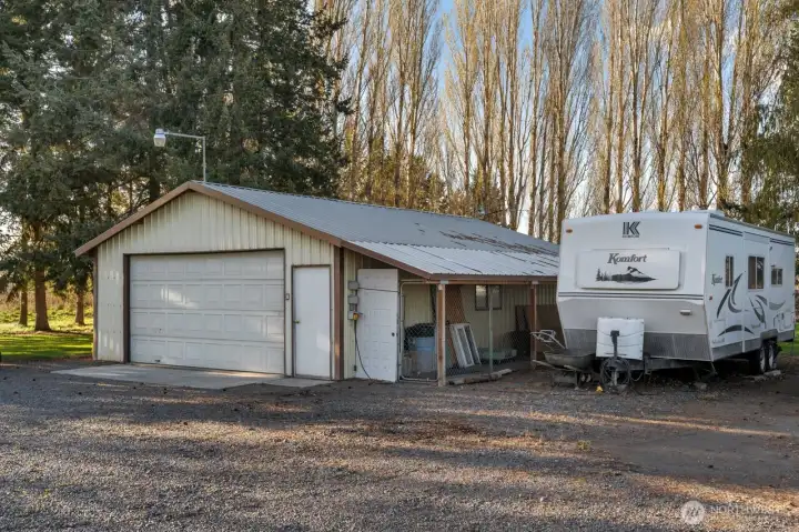 Large heated garage with insulated door, huge dog run with overhand and 3 - 30-amp RV hook ups.