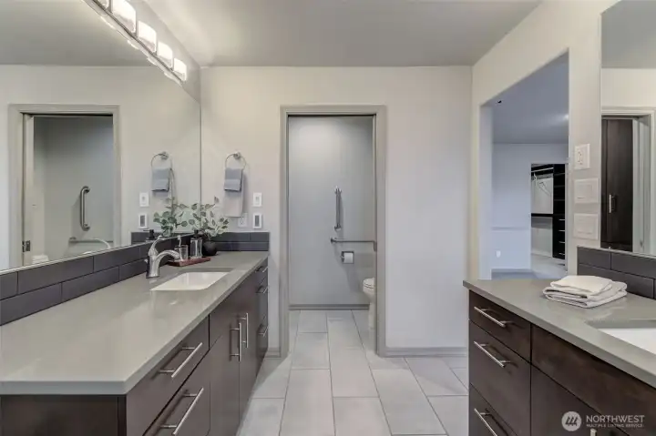 Double vanities, double shower heads, towel warmers, heated floor