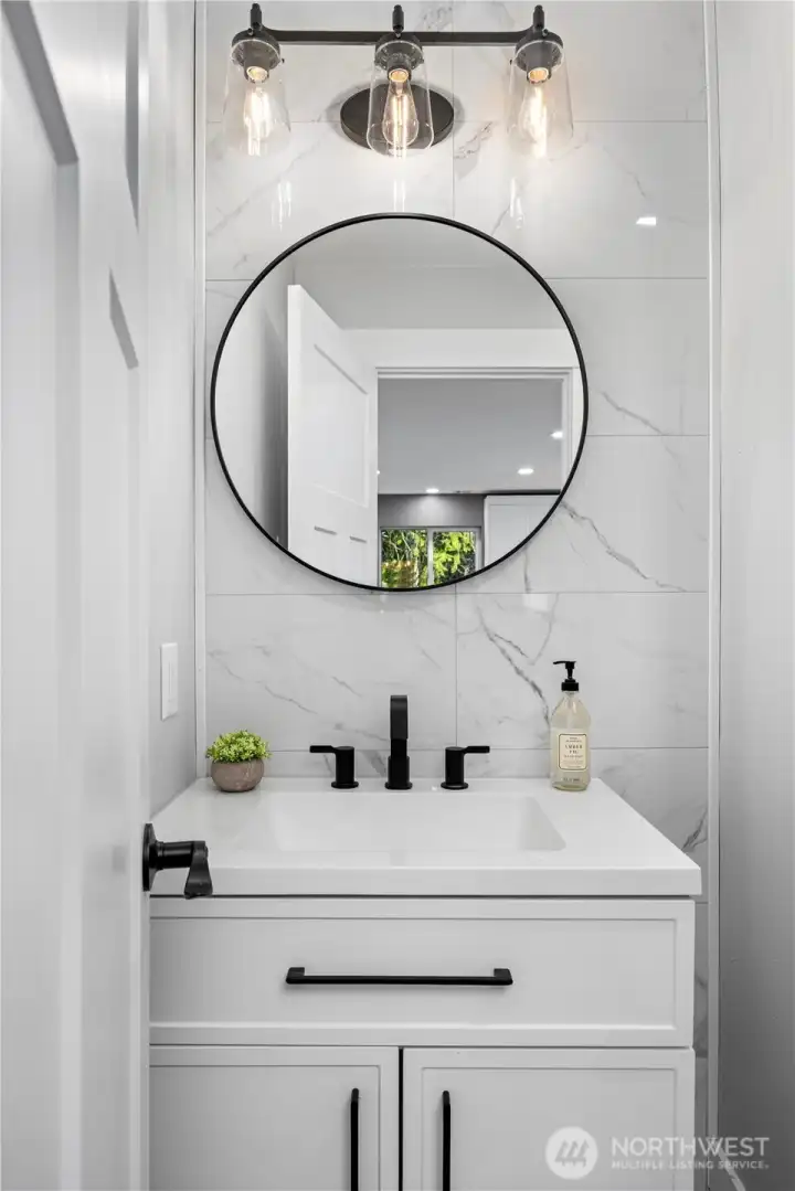 Main floor powder room off kitchen.