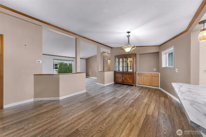 Off the kitchen is the formal dining area, with custom built ins and additional buffet area