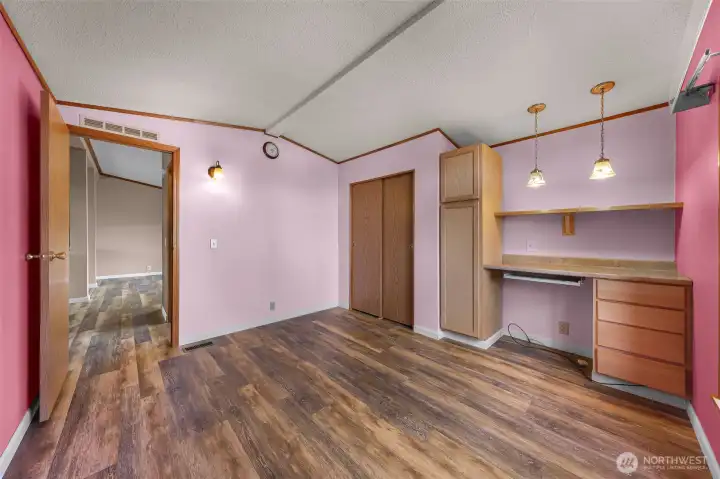 Guest room #2 with custom built ins to use as office space with plenty of room for a hobby table or murphy bed for additional guests