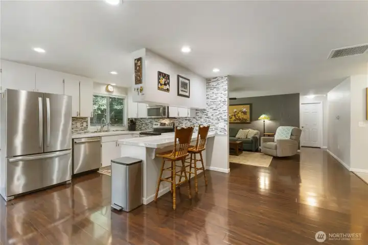 Kitchen boasts Moen water filter at sink, and to refrigerator, dining room, eating bar, and SS appliances!