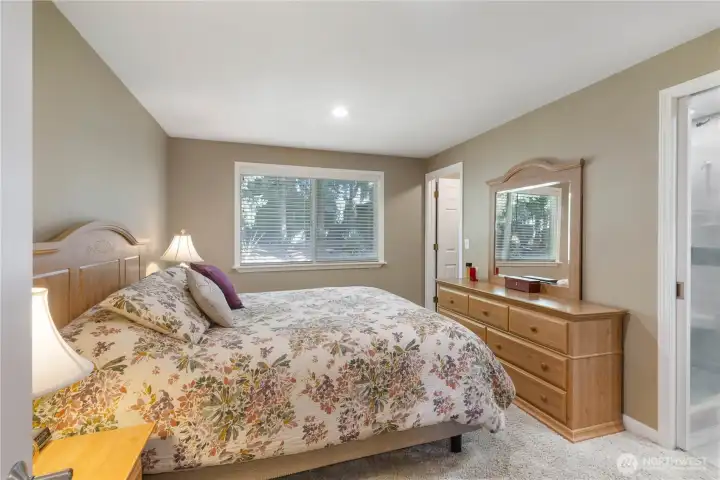 Primary Bedroom window faces rear of home.