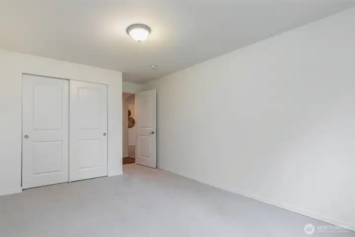 Bedroom #1 on the main level - with fresh new carpet & interior paint.