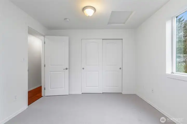 Bedroom #3 on the upper level w/access to the attic.