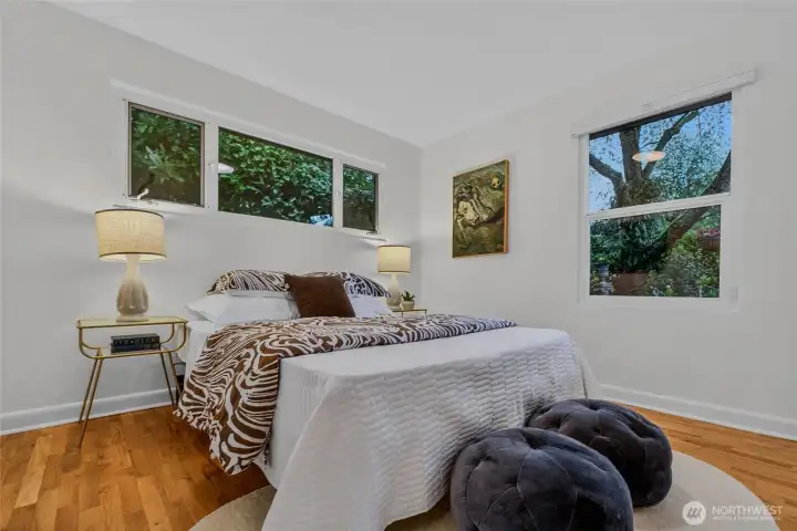 East facing bedroom on the main level looks out onto the front gardens.