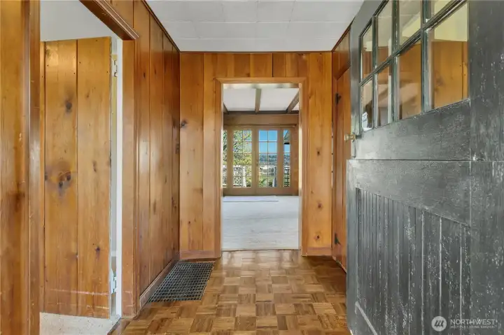 Front door opens into hallway with real paquet flooring. Notice the dutch-door.